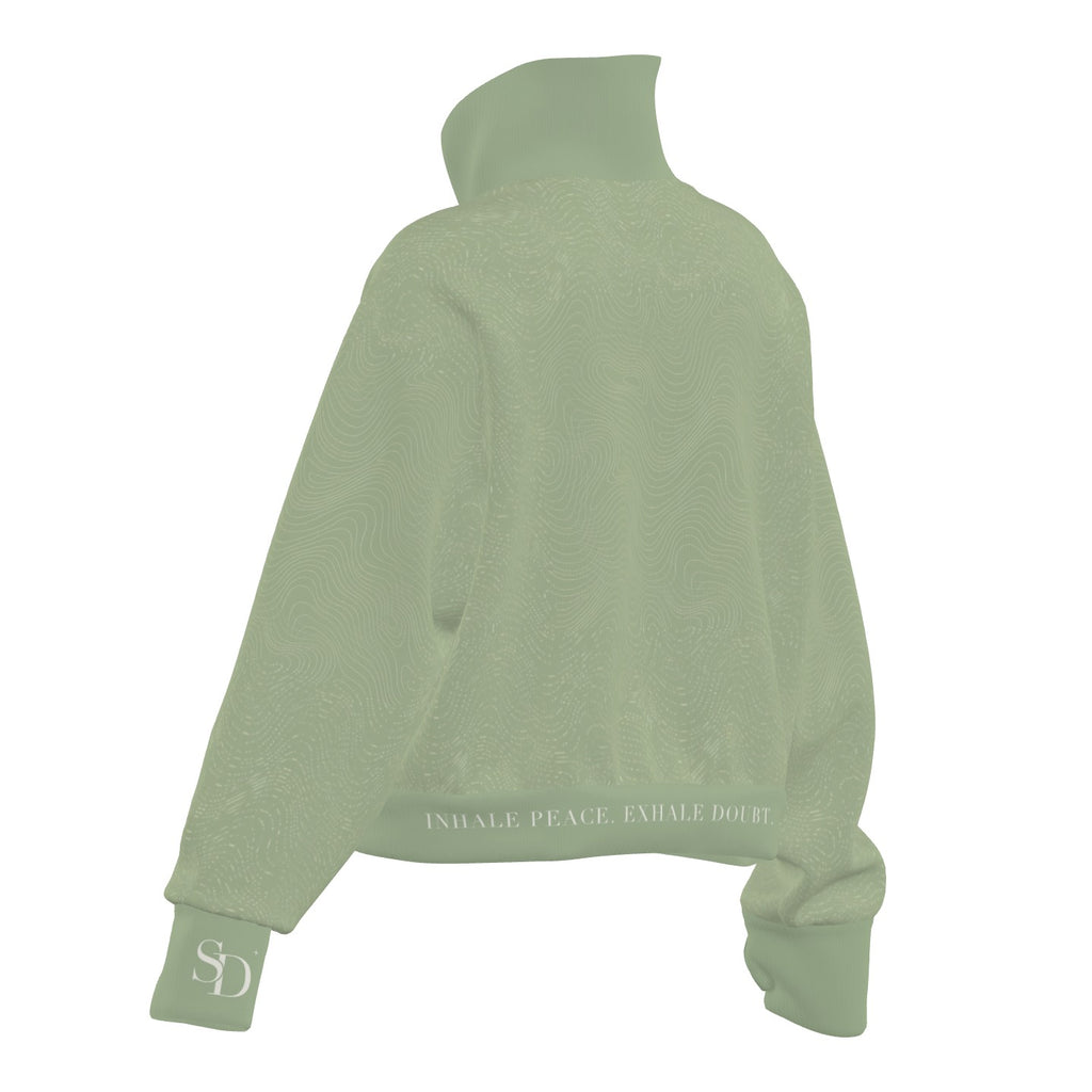 Breath Lines Sage half-zip, back view with INHALE PEACE. EXHALE DOUBT. on the hem and SD on the cuff