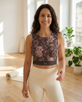 Woman wearing the Midnight Peony yoga crop tank in a sunlit yoga studio